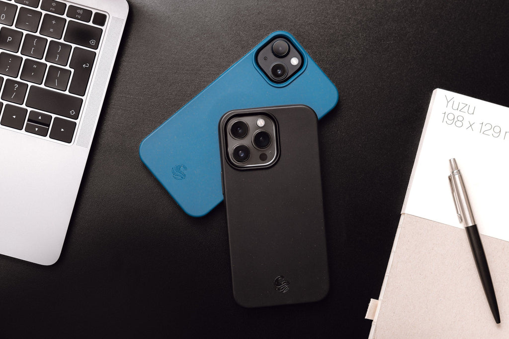 Image of two iPhones screen down on a work desk protected by Wave Case phone cases