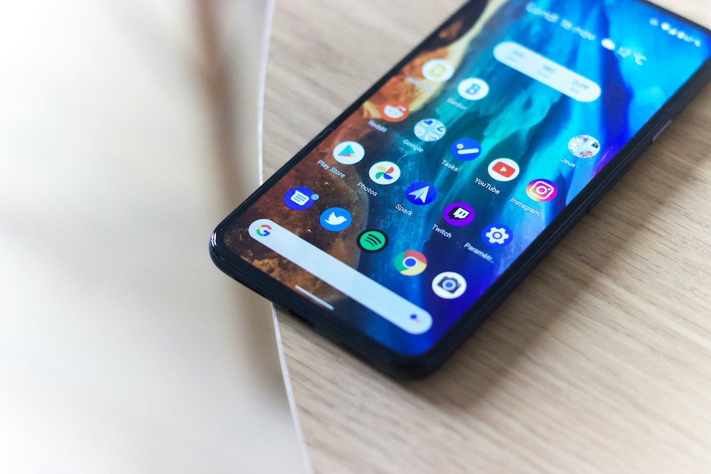 android phone laid flat on table displaying android screen