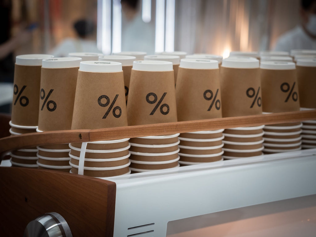 Sustainable paper cups piled together on display