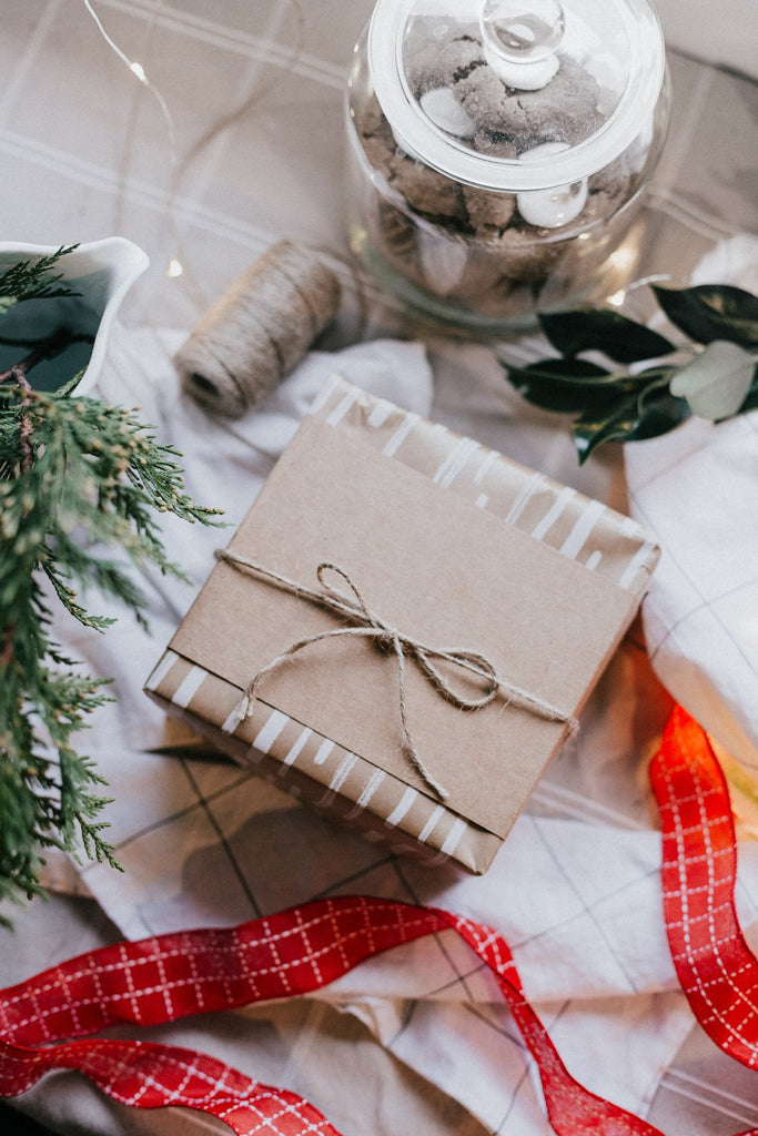 Christmas presents wrapped in brown paper sustainable packaging